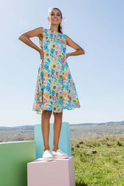 Model Vitoria wearing size 10 of the Zoey Shift Dress in colour Meadow (Blue), from the front, showing the whole outfit