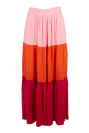 Product shot of the Poppy Tier Skirt in colour Sunset (Pink), from the front
