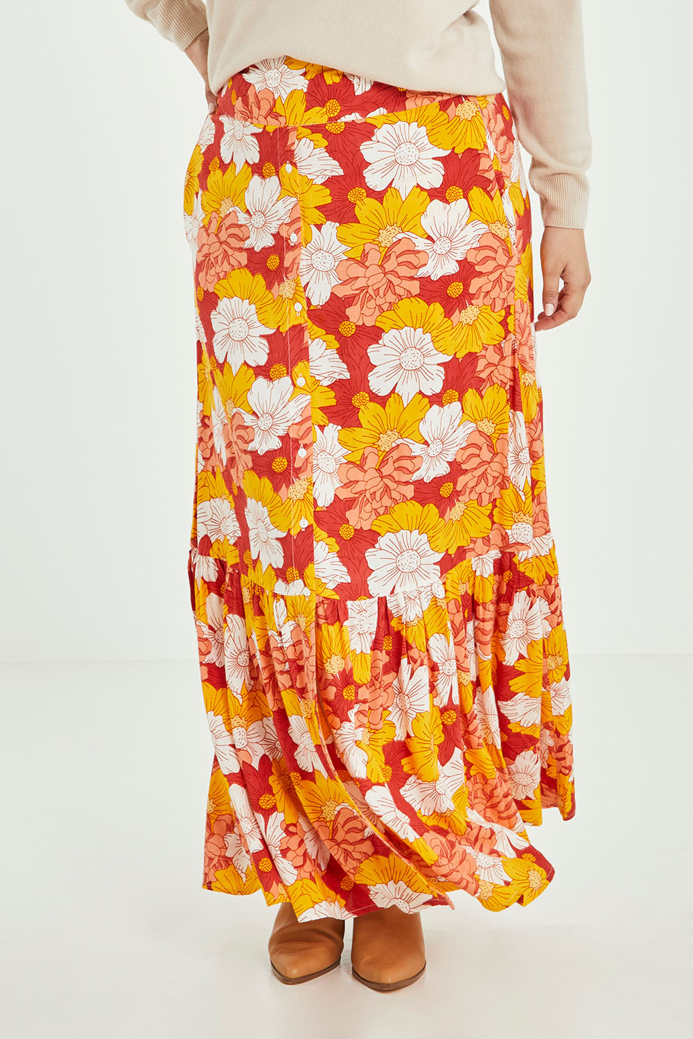 Model Jess wearing size 14 of the Heather Maxi Skirt in colour Wallflower, from the front, cropped image