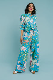 Model Natalie wearing size 10 of the Selena Shirt in colour Garden (Blue), from the front, showing the whole outfit