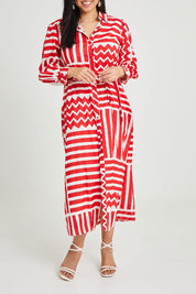 Model Terri-Leigh wearing size 14 of the Abby Shirt Dress in colour Patchwork (Red), from the front, cropped image
