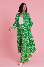 Model Natalie wearing size 10 of the Abby Shirt Dress in colour Zinnia (Green), from the front, showing the whole outfit