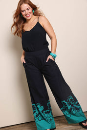 Model Georgiel wearing size 10 of the Stella Cotton Pant – Pansies in colour Pansies, from the front