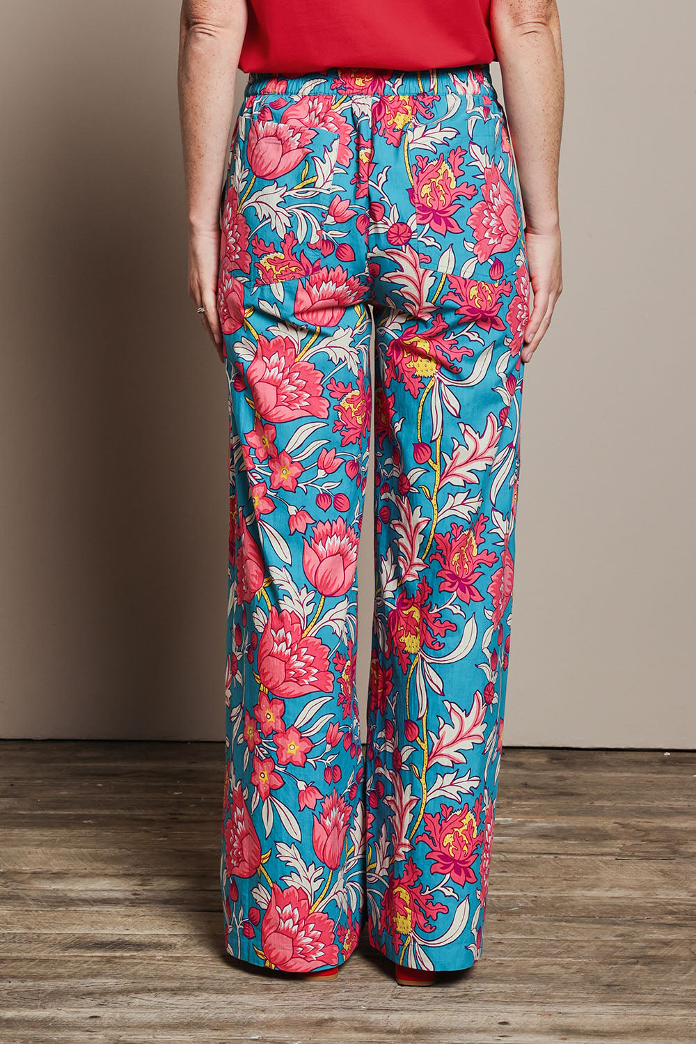 Model Katie wearing size 10 of the Stella Cotton Pant in colour Thistle, from the back