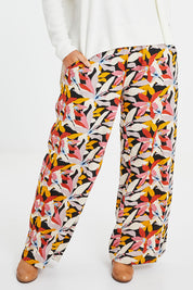 Model Laura wearing size 14 of the Stella Print Pant in colour Floral (Blue), from the front, cropped image