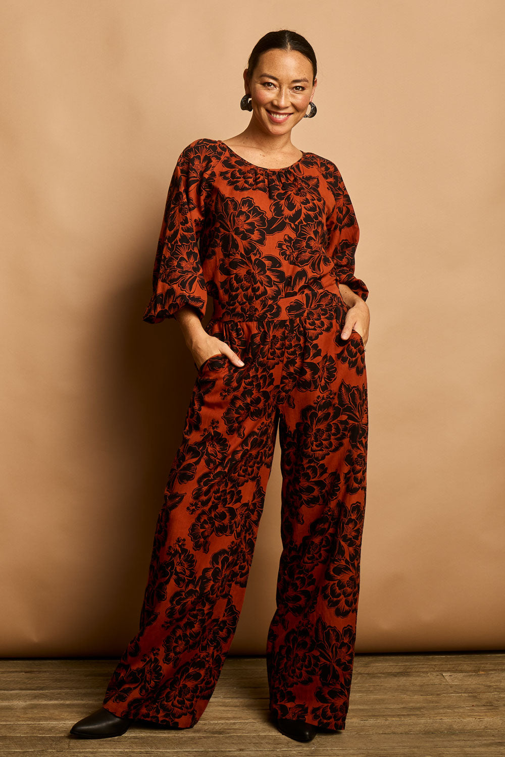 Model Katie wearing size 10 of the Jess Blouse in colour Blooming (Black), from the front, showing the whole outfit