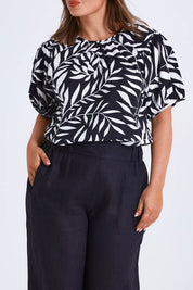 Model Monique wearing size 14 of the Rachel Bell Sleeve Top in colour Vines (Black), from the front, cropped image