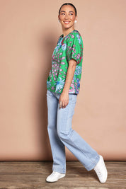 Model Katie wearing size 10 of the Rachel Cotton Top in colour Greengard (Green), from the front, showing the whole outfit