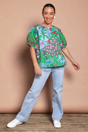 Model Katie wearing size 10 of the Rachel Cotton Top in colour Greengard (Green), from the front, showing the whole outfit