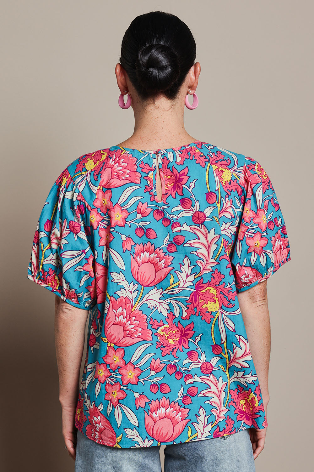 Model Katie wearing size 10 of the Rachel Cotton Top in colour Thistle, from the back