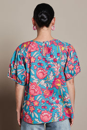 Model Katie wearing size 10 of the Rachel Cotton Top in colour Thistle, from the back
