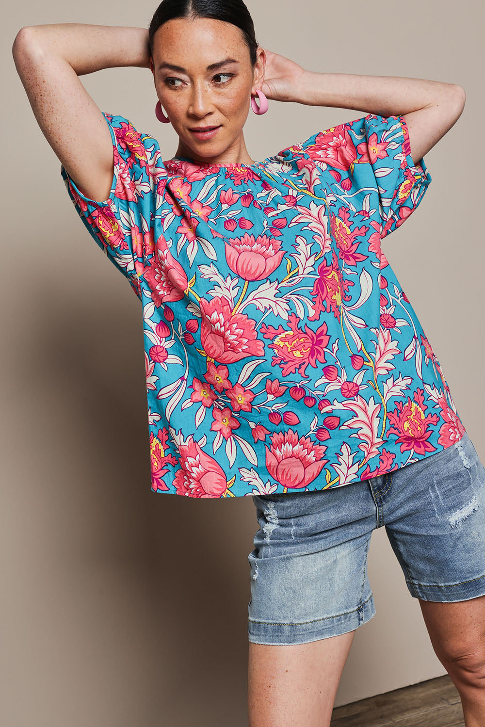 Model Katie wearing size 10 of the Rachel Cotton Top in colour Thistle, from the front, cropped image