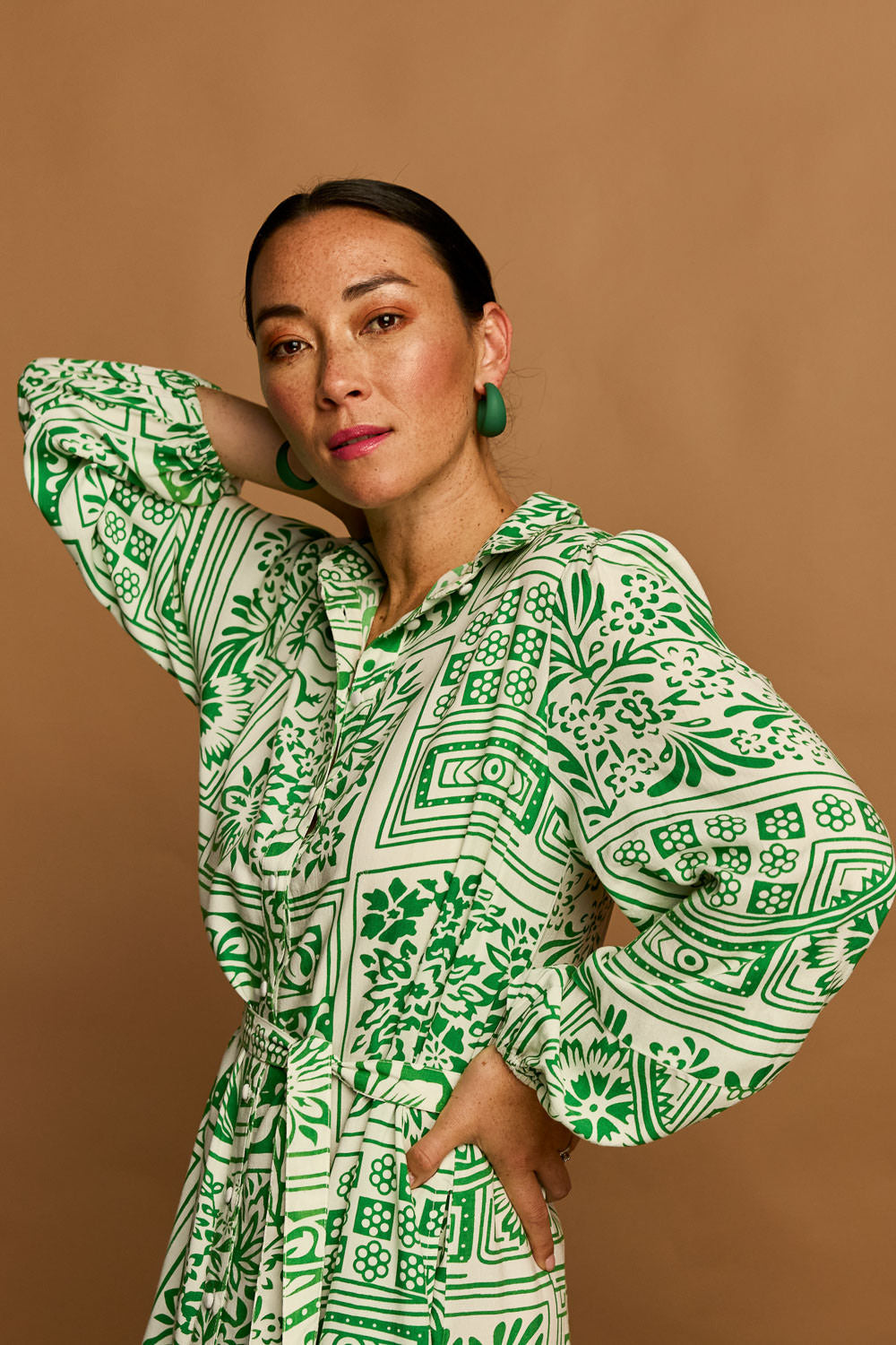 Model Katie wearing size 10 of the Lucy Shirt Dress in colour Labyrinth (Green), from the front, showing the whole outfit