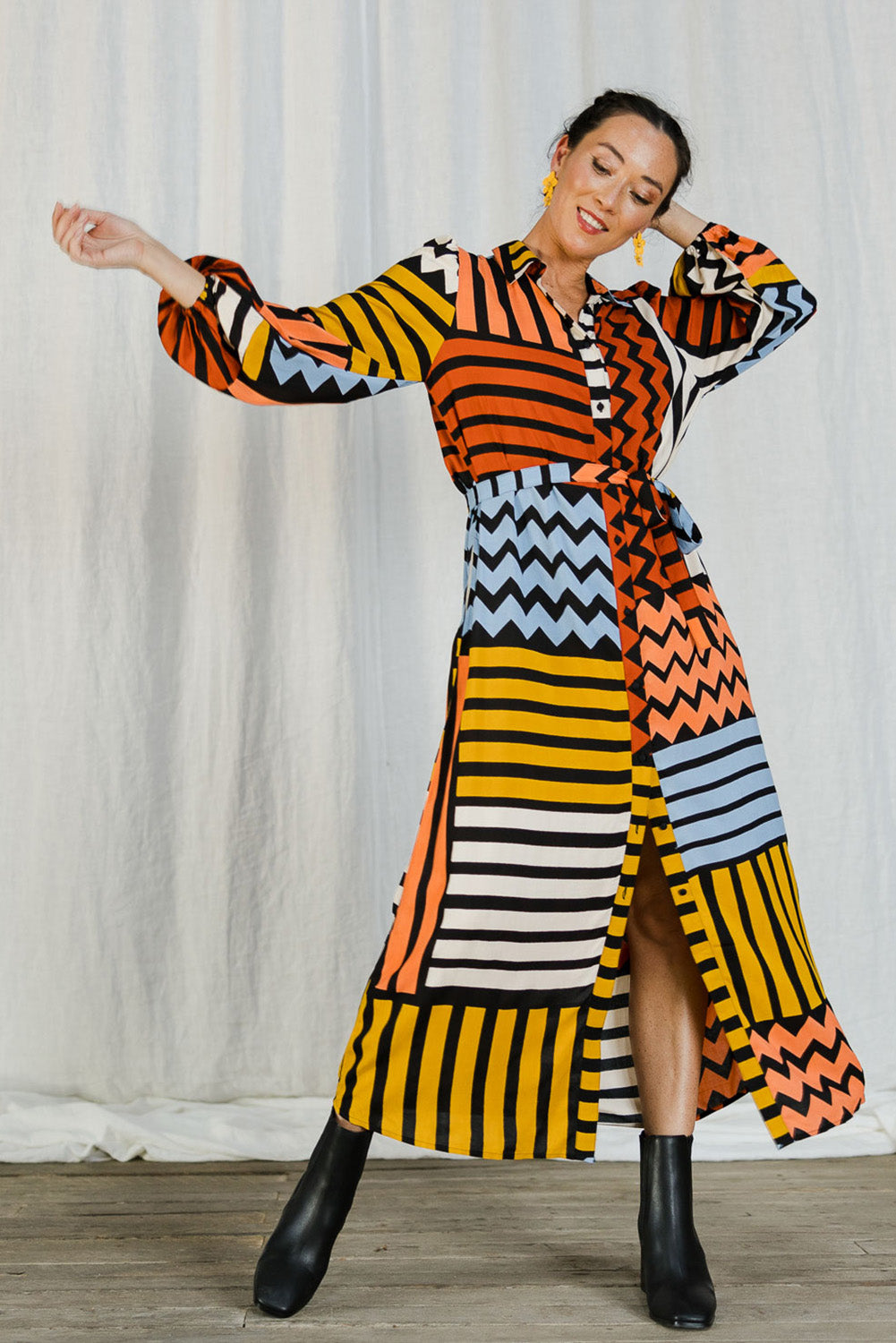 Model Katie wearing size 10 of the Lucy Shirt Dress in colour Lines (Black), from the front, showing the whole outfit