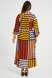 Model Laura wearing size 14 of the Lucy Shirt Dress in colour Lines (Black), from the back