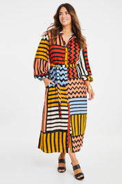 Model Laura wearing size 14 of the Lucy Shirt Dress in colour Lines (Black), from the front, showing the whole outfit