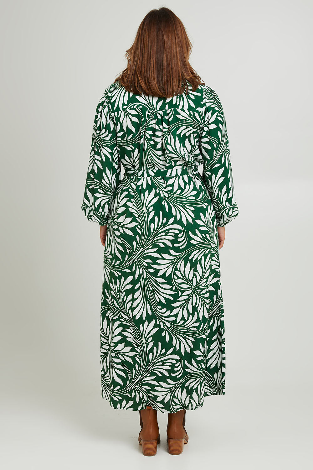 Model Monique wearing size 14 of the Lucy Shirt Dress in colour Swirl (Green), from the back