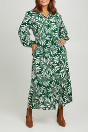 Model Monique wearing size 14 of the Lucy Shirt Dress in colour Swirl (Green), from the front, cropped image