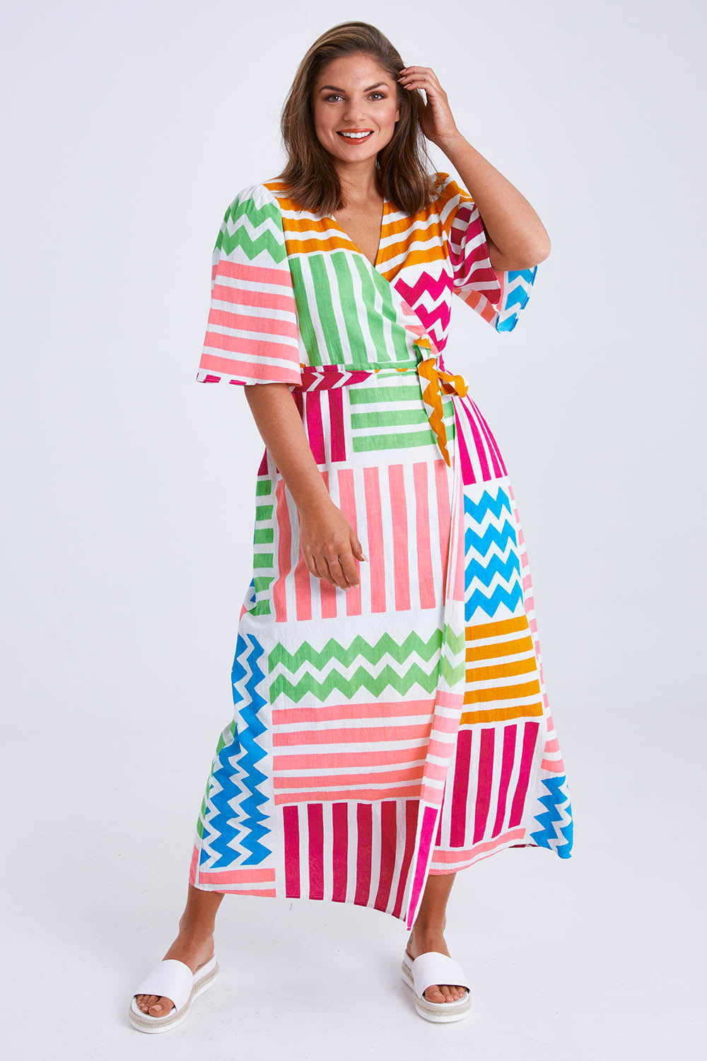 Model Monique wearing size 14 of the Ginerva Wrap Dress in colour Patchwork (White), from the front, showing the whole outfit