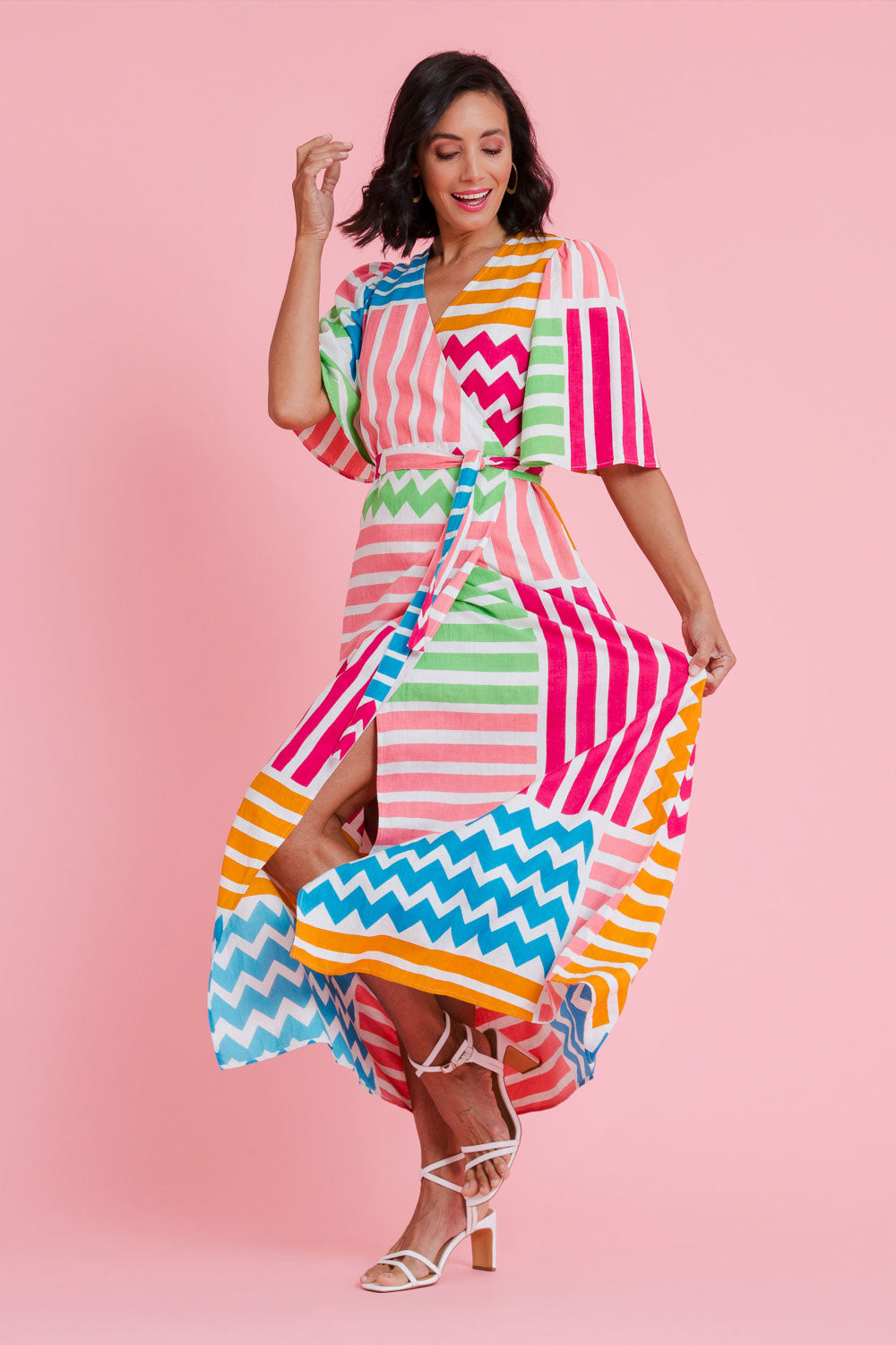 Model Natalie wearing size 10 of the Ginerva Wrap Dress in colour Patchwork (White), from the front, showing the whole outfit