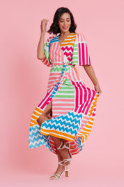 Model Natalie wearing size 10 of the Ginerva Wrap Dress in colour Patchwork (White), from the front, showing the whole outfit