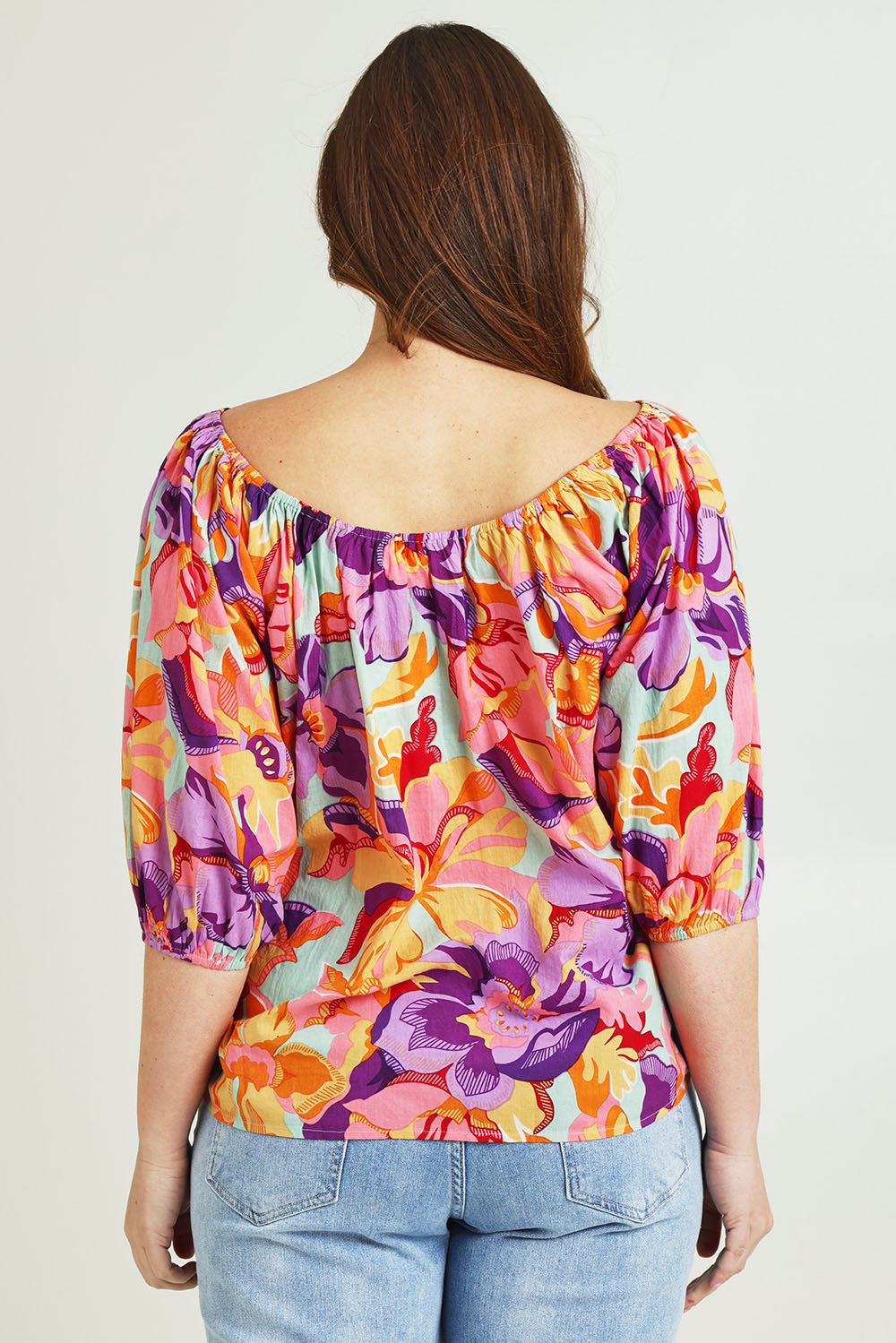 Model Jane wearing size 14 of the Sofia Cotton Top in colour Botanical, from the back