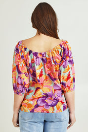 Model Jane wearing size 14 of the Sofia Cotton Top in colour Botanical, from the back