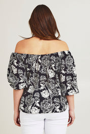 Model Jane wearing size 14 of the Sofia Cotton Top in colour Wildflower (Black), from the back