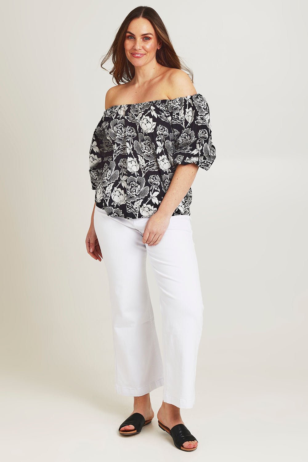 Model Jane wearing size 14 of the Sofia Cotton Top in colour Wildflower (Black), from the front, showing the whole outfit