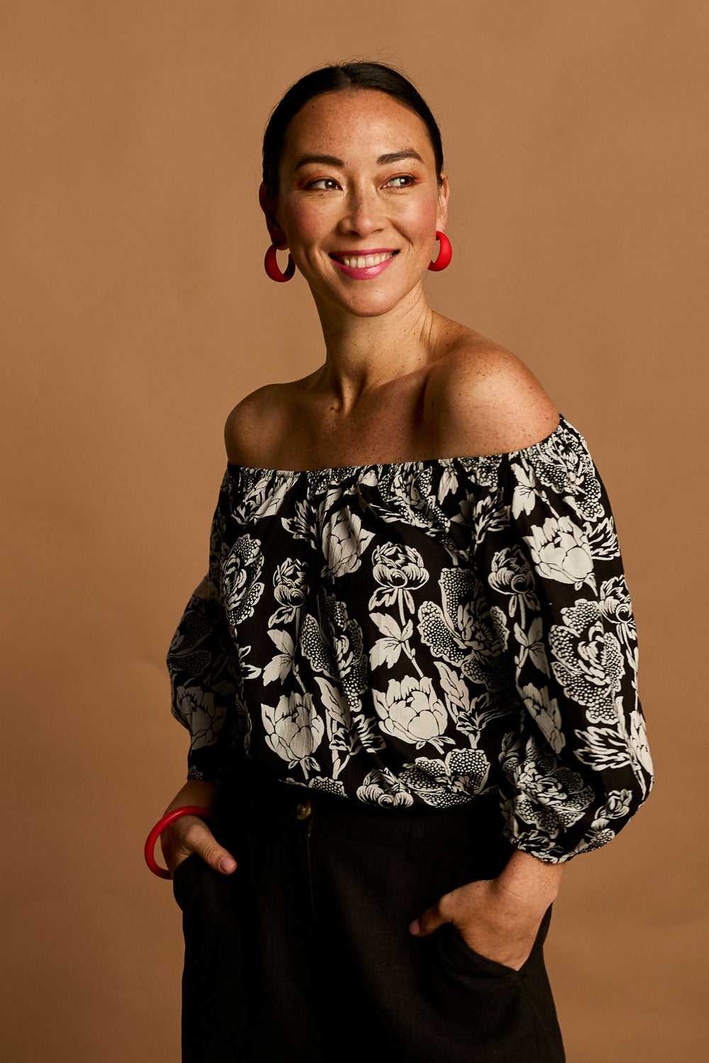 Model Katie wearing size 10 of the Sofia Cotton Top in colour Wildflower (Black), from the front, showing the whole outfit