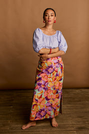 Model Katie wearing size 10 of the Clara Cotton Maxi Skirt in colour Botanical, from the front, showing the whole outfit