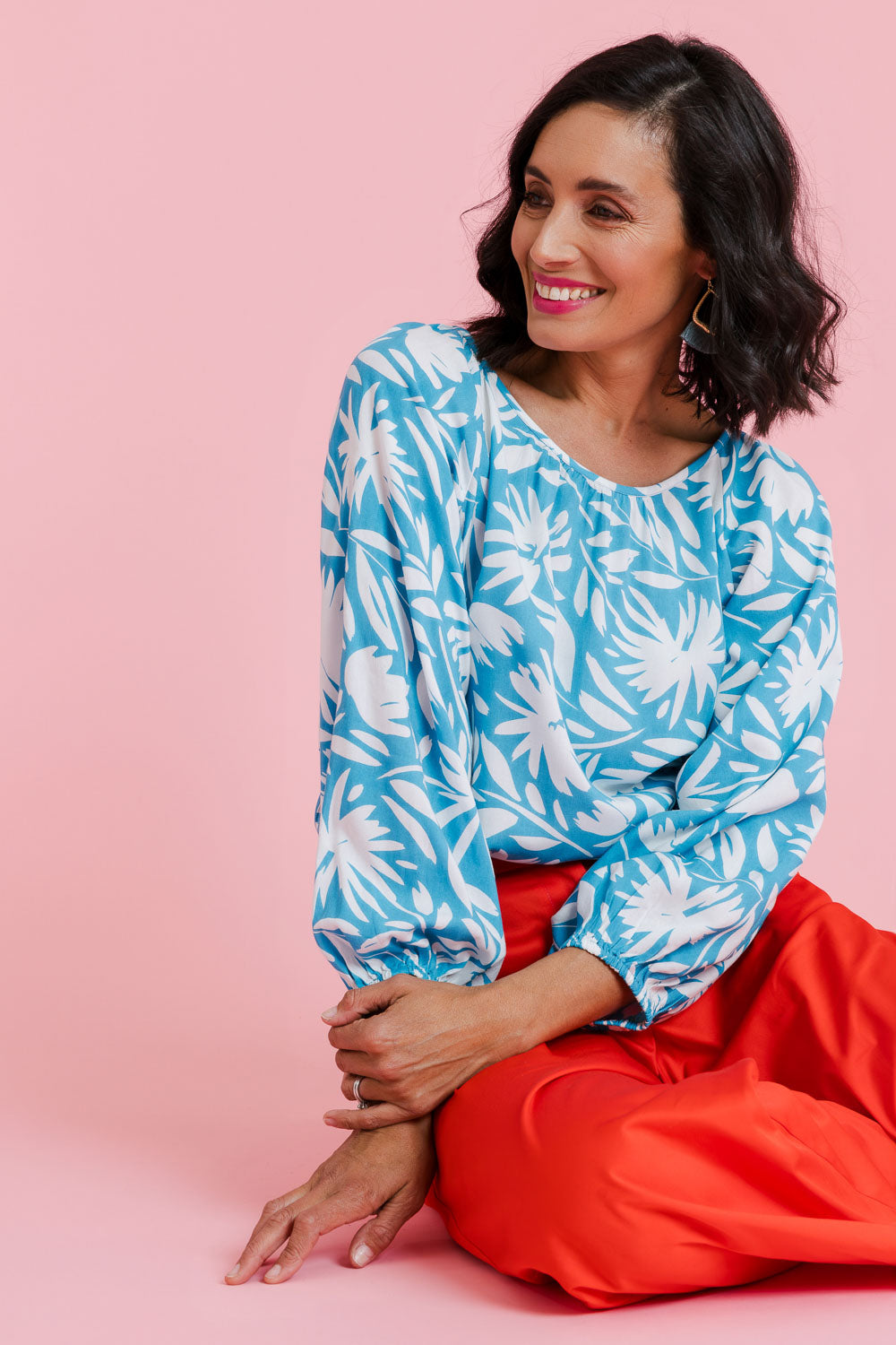 Model Natalie wearing size 10 of the Francesca Top in colour Gerbera (Blue), from the front, showing the whole outfit