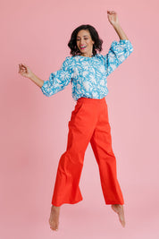 Model Natalie wearing size 10 of the Francesca Top in colour Gerbera (Blue), from the front, showing the whole outfit