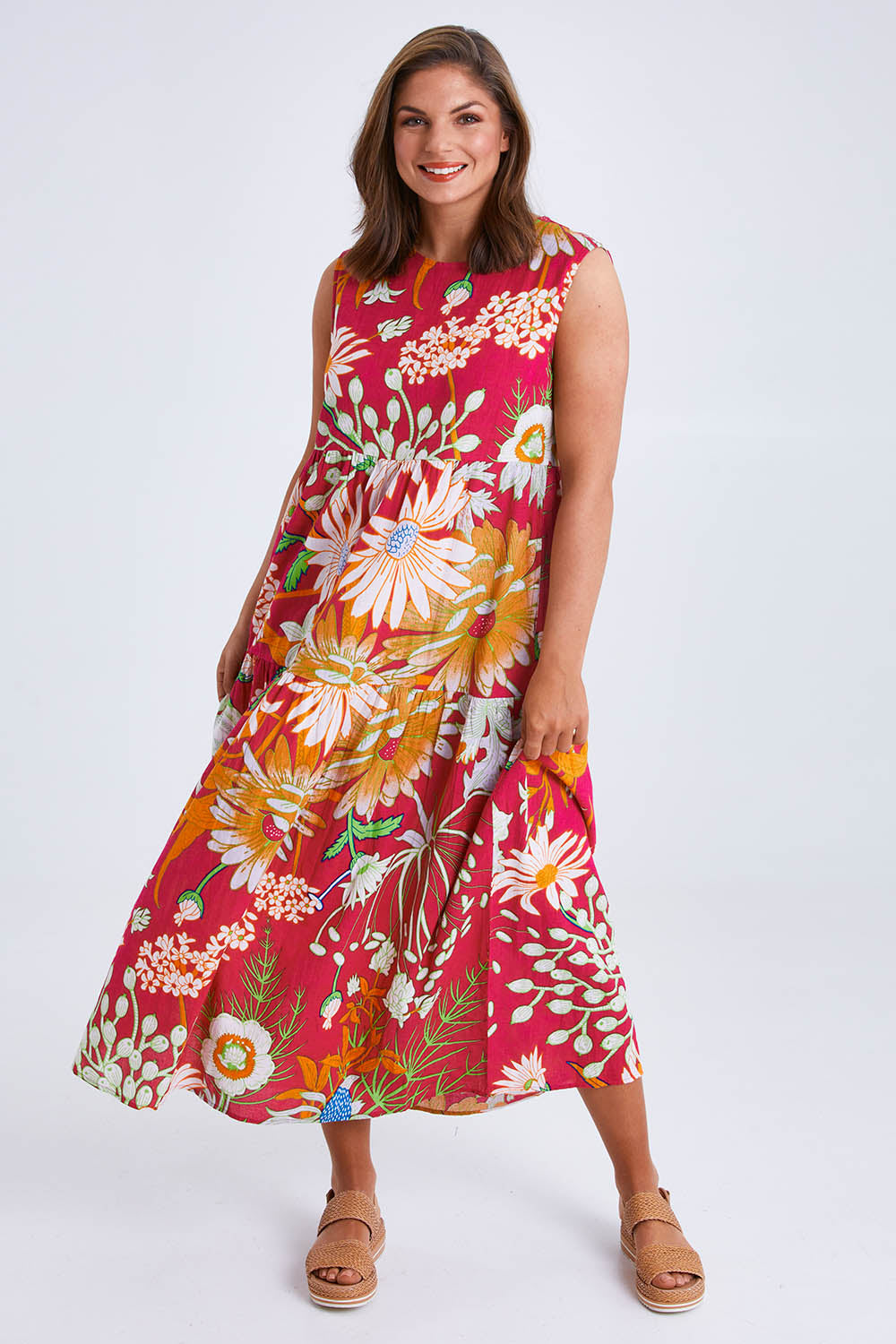 Model Monique wearing size 14 of the Monica Maxi Dress in colour Garden (Pink), from the front, showing the whole outfit