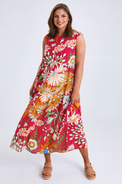 Model Monique wearing size 14 of the Monica Maxi Dress in colour Garden (Pink), from the front, showing the whole outfit