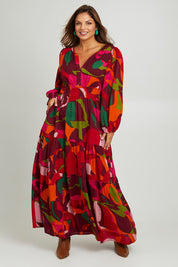 Model Monique wearing size 14 of the Gabbie Maxi Dress in colour Marble (Red), from the front, showing the whole outfit