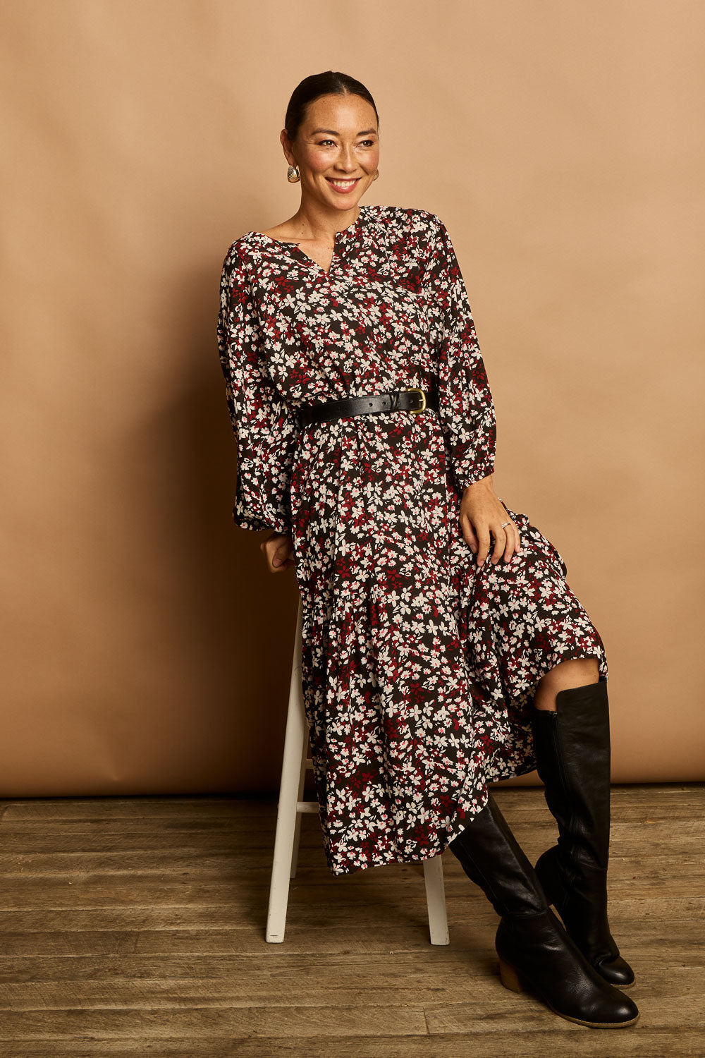 Model Katie wearing size 10 of the Ashley Dress in colour Flutter (Black), from the front, showing the whole outfit