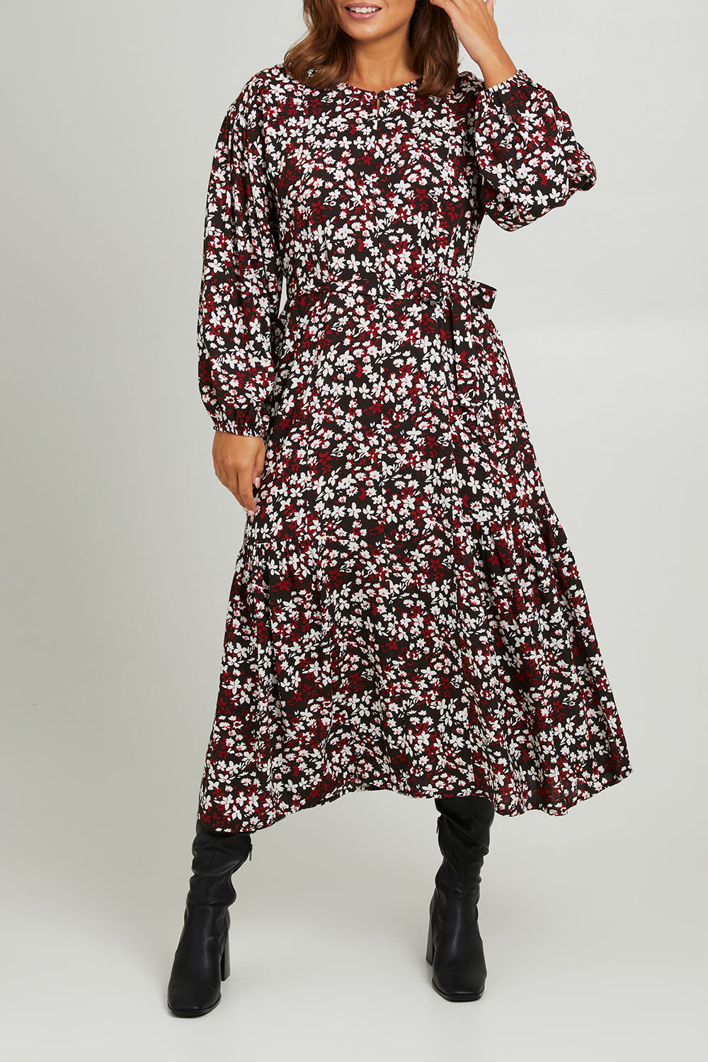 Model Monique wearing size 14 of the Ashley Dress in colour Flutter (Black), from the front, cropped image