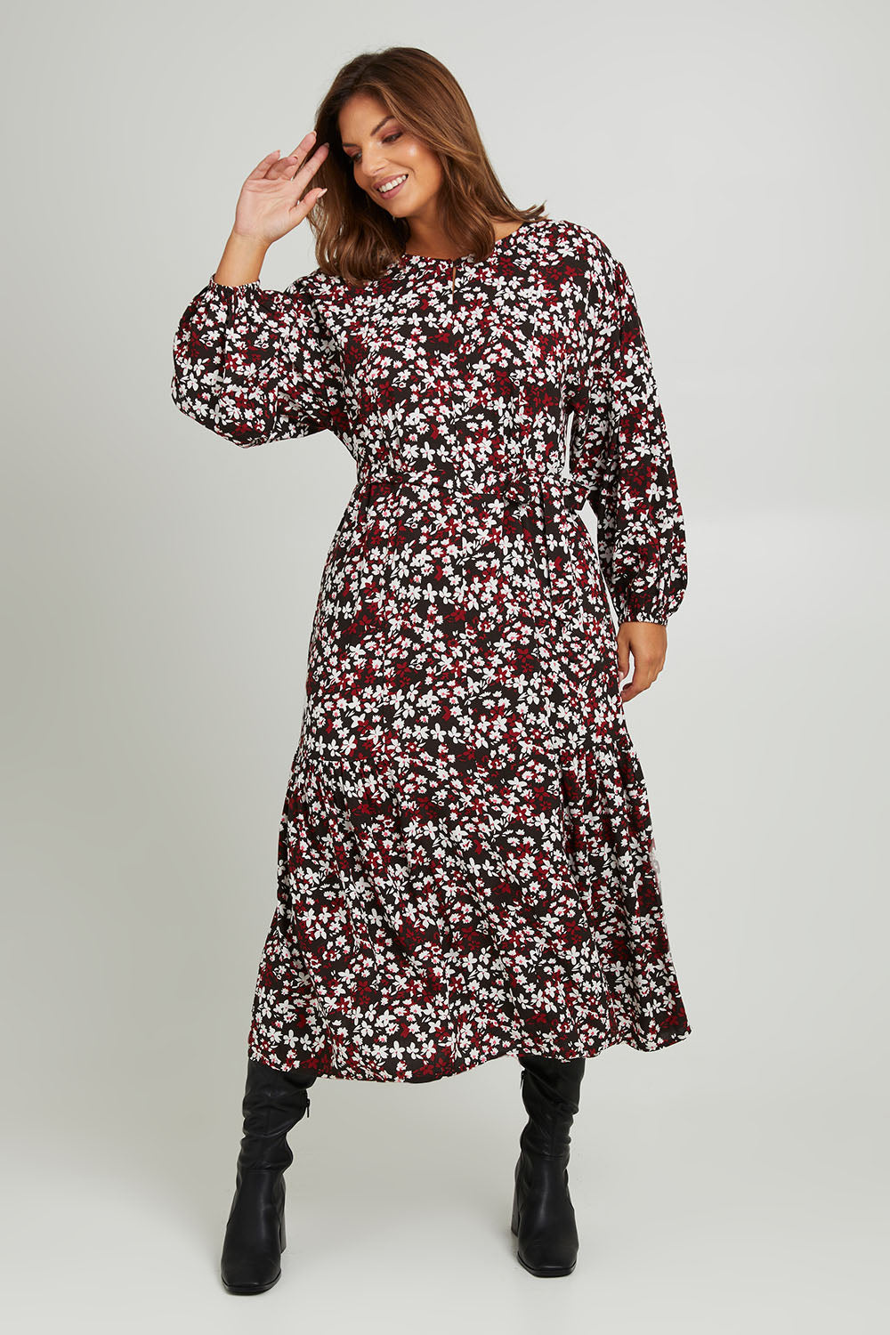 Model Monique wearing size 14 of the Ashley Dress in colour Flutter (Black), from the front, showing the whole outfit