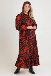 Model Chanel wearing size 16 of the Nikki Cotton Maxi Dress in colour Tigerleaf, from the front, showing the whole outfit
