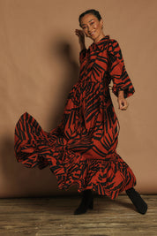 Model Katie wearing size 10 of the Nikki Cotton Maxi Dress in colour Tigerleaf, from the front, showing the whole outfit