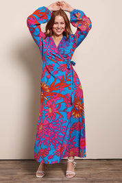 Model Georgiel wearing size 10 of the Daphne Maxi Wrap Dress – Bluegarden in colour Bluegarden, from the front