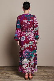 Model Katie wearing size 10 of the Daphne Maxi Wrap Dress in colour Garden, from the back