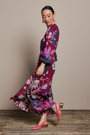 Model Katie wearing size 10 of the Daphne Maxi Wrap Dress in colour Garden, from the front, showing the whole outfit