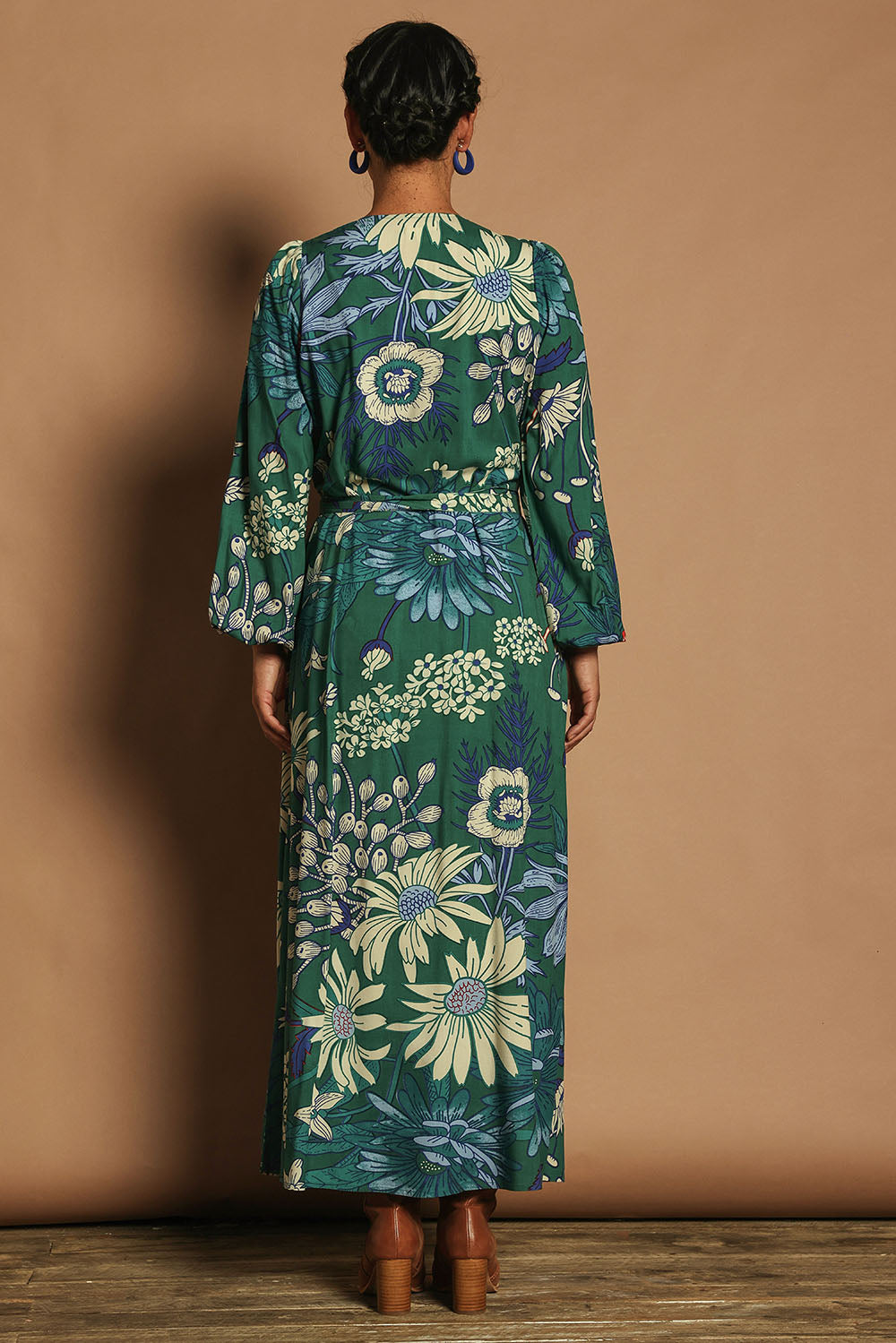 Model Katie wearing size 10 of the Daphne Maxi Wrap Dress in colour Darkgarden (Green), from the back