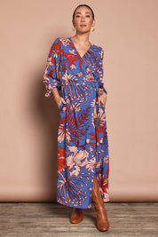 Model Katie wearing size 10 of the Daphne Maxi Wrap Dress in colour Gardenblue (Blue), from the front, showing the whole outfit