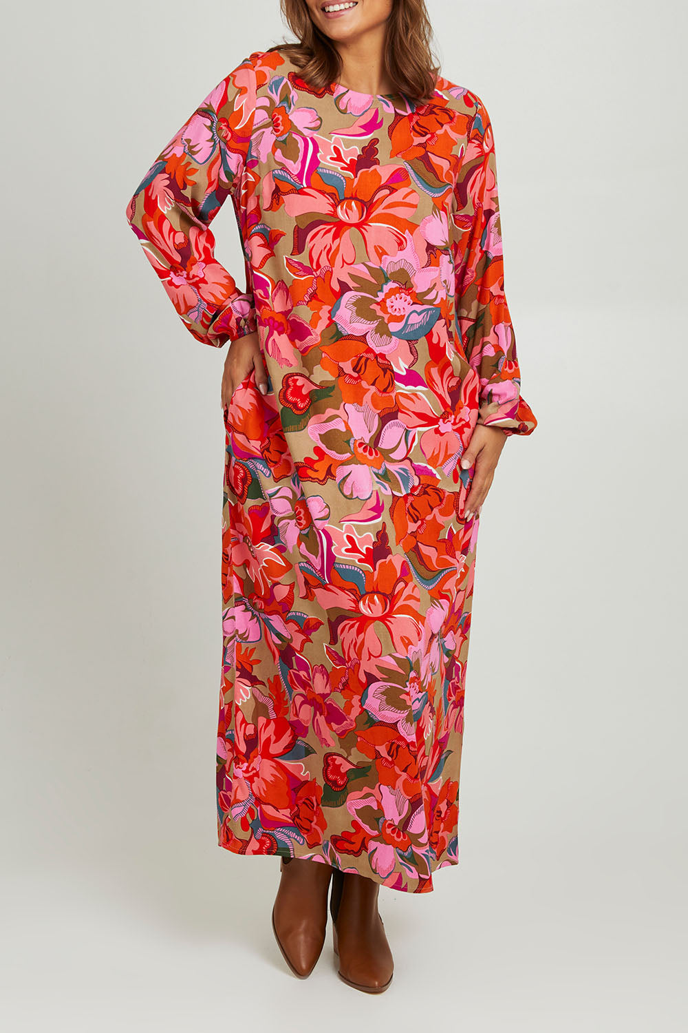 Model Monique wearing size 14 of the Zara Shift Dress in colour Botanical (Red), from the front, cropped image