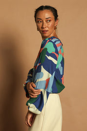 Model Katie wearing size 10 of the Harriet Blouse in colour Marble (Blue), from the front, cropped image