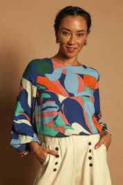 Model Katie wearing size 10 of the Harriet Blouse in colour Marble (Blue), from the front, showing the whole outfit
