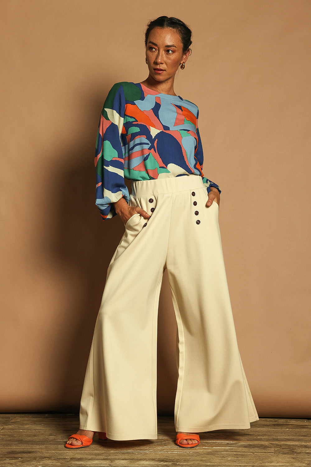 Model Katie wearing size 10 of the Harriet Blouse in colour Marble (Blue), from the front, showing the whole outfit